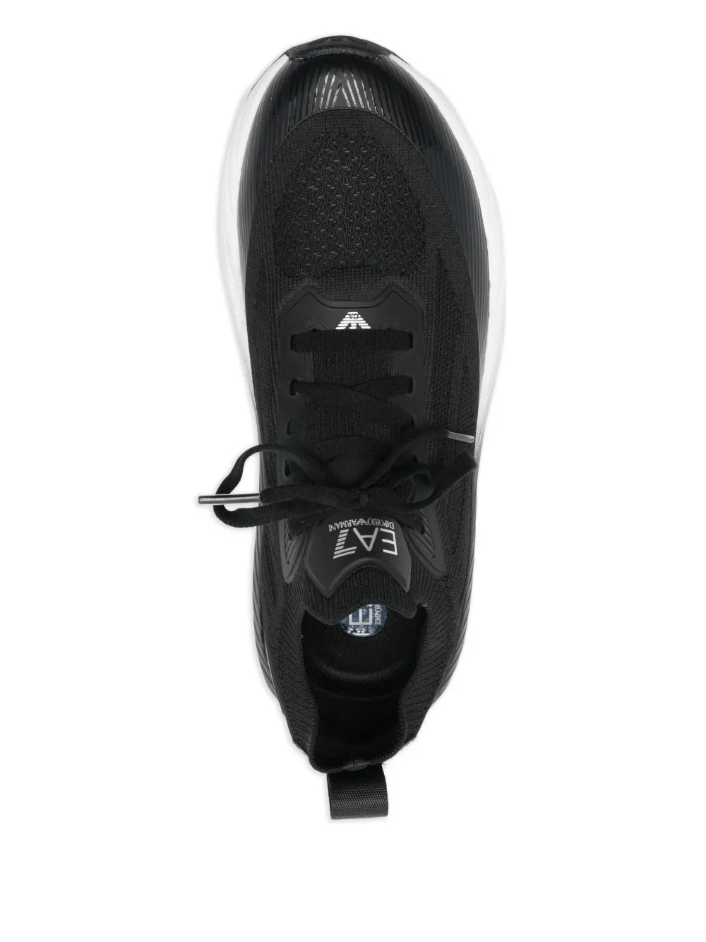 Black lace-up trainers top view, laces, and EA7 logo on the tongue