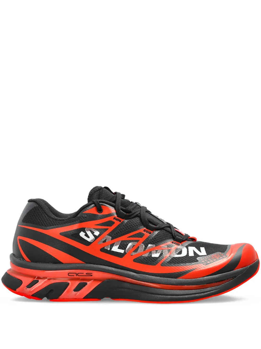 Orange and black lace-up sneakers with bold geometric stripes and thick rubber sole.