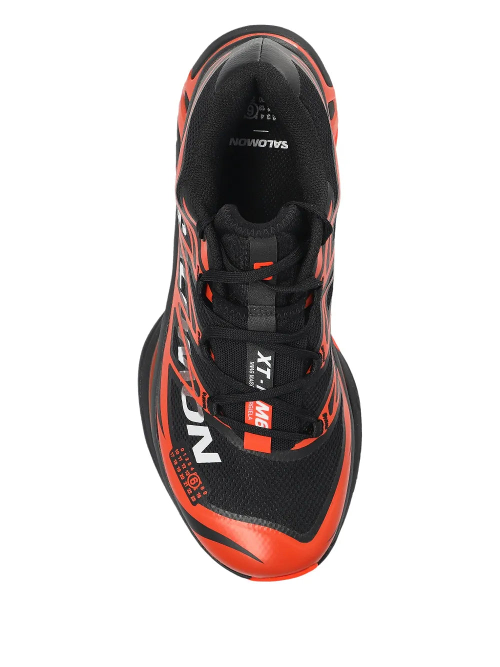 Black and orange lace-up sneakers with padded tongue, black laces, and logo accents.