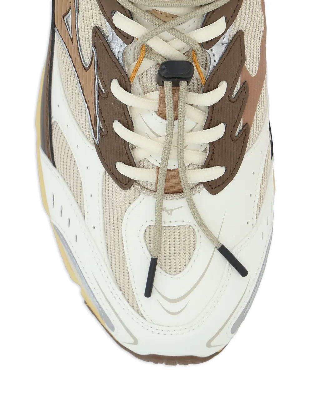 White and brown Mizuno sneakers close-up of laces, eyelets, and logo panels
