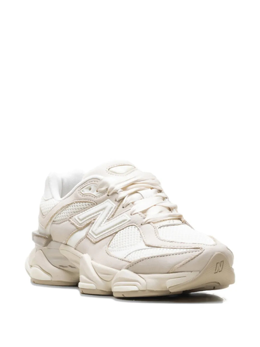 White lace-up sneakers side view with textured panels and N branding