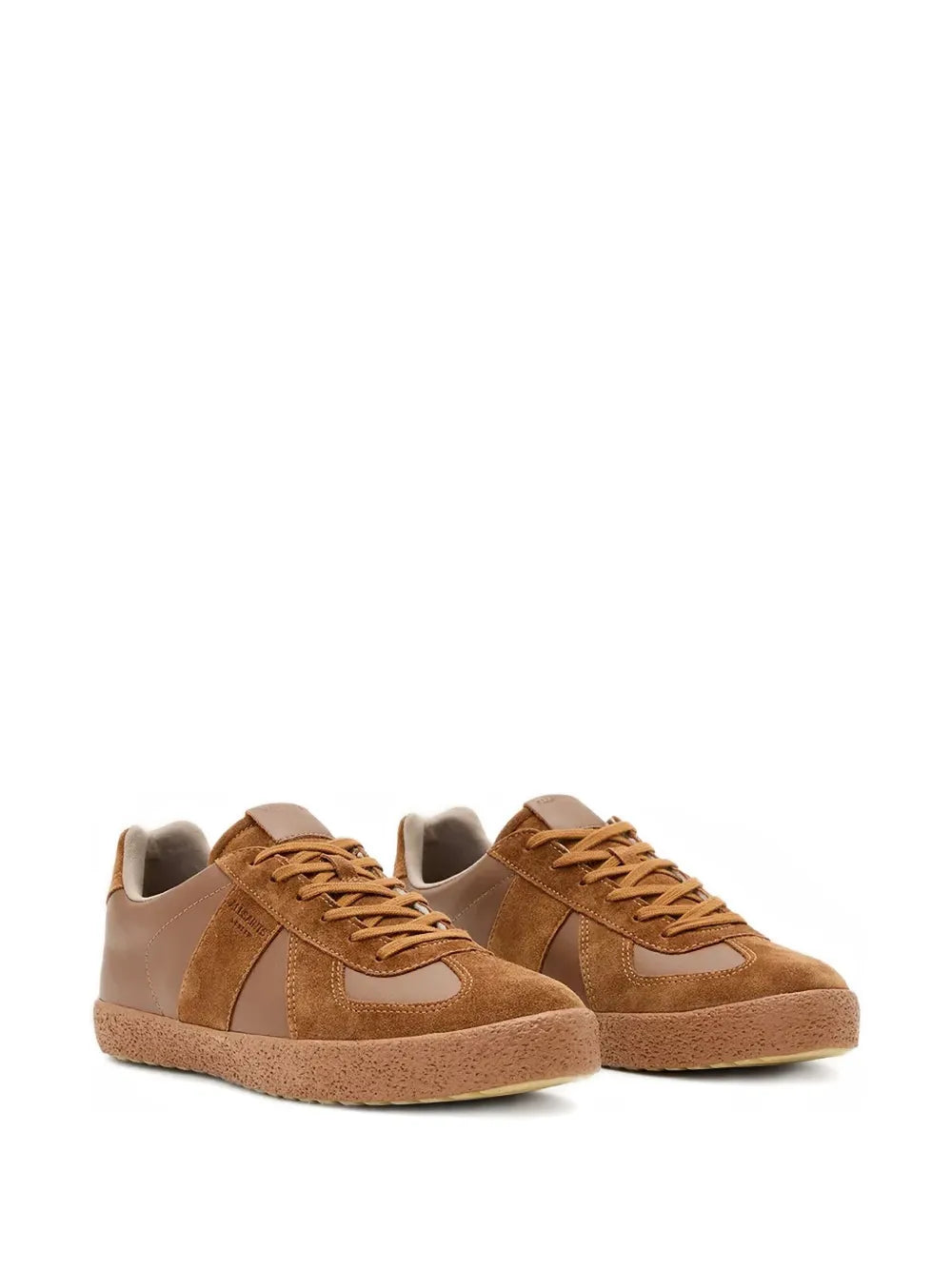 Pair of brown lace-up sneakers with suede uppers, contrast panels, and flat rubber soles