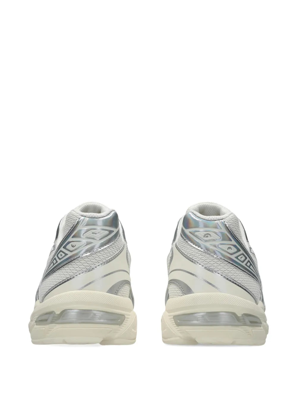 Light gray sneakers with cream midsoles, heel view