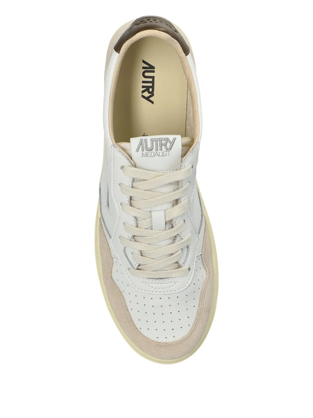 White leather sneaker with laced front, beige lining and Autry logo on insole.