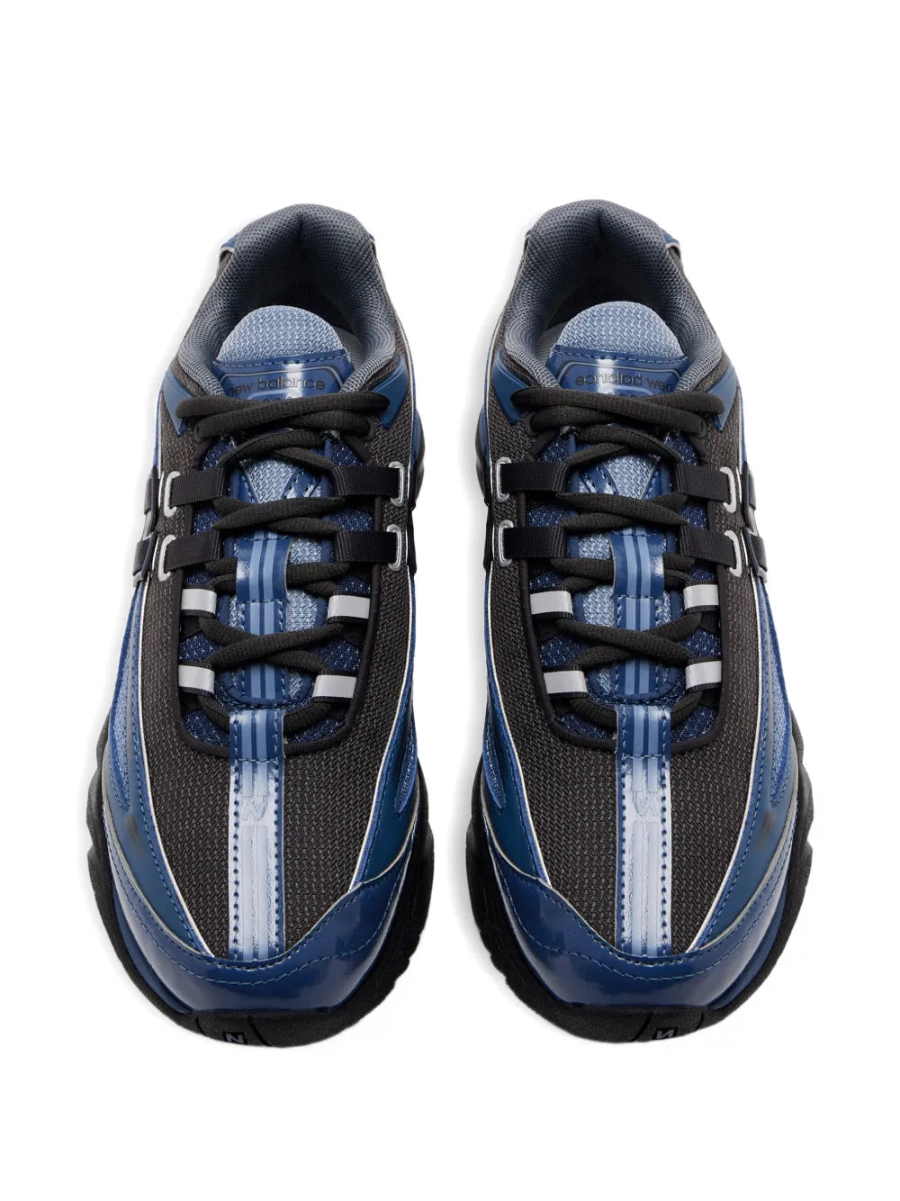 Pair of blue and dark gray low-top sneakers with black laces and padded tongue
