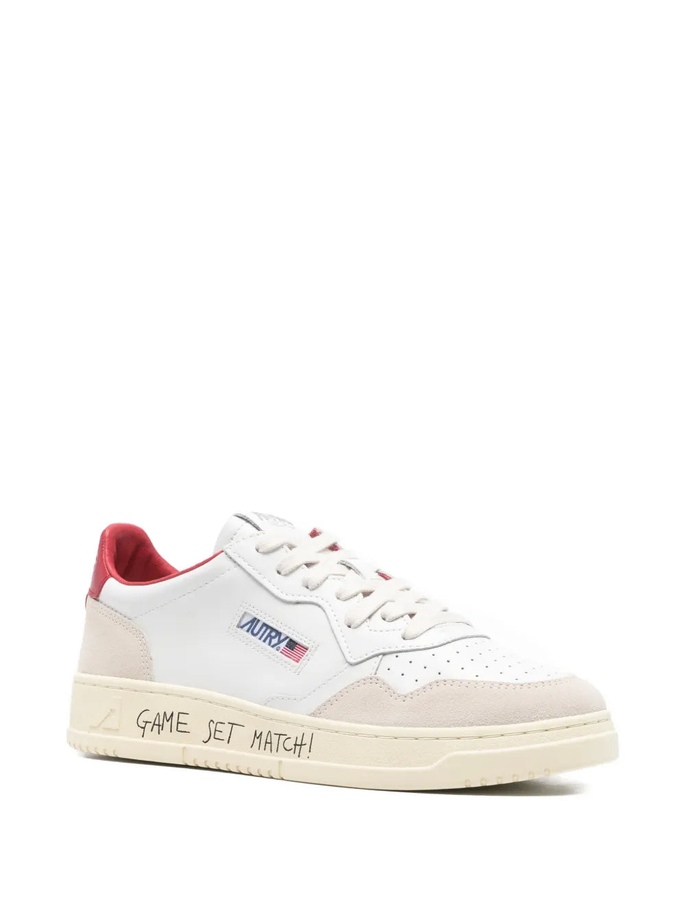 White low trainers with red collar, side Autry logo, and GAME SET MATCH! midsole