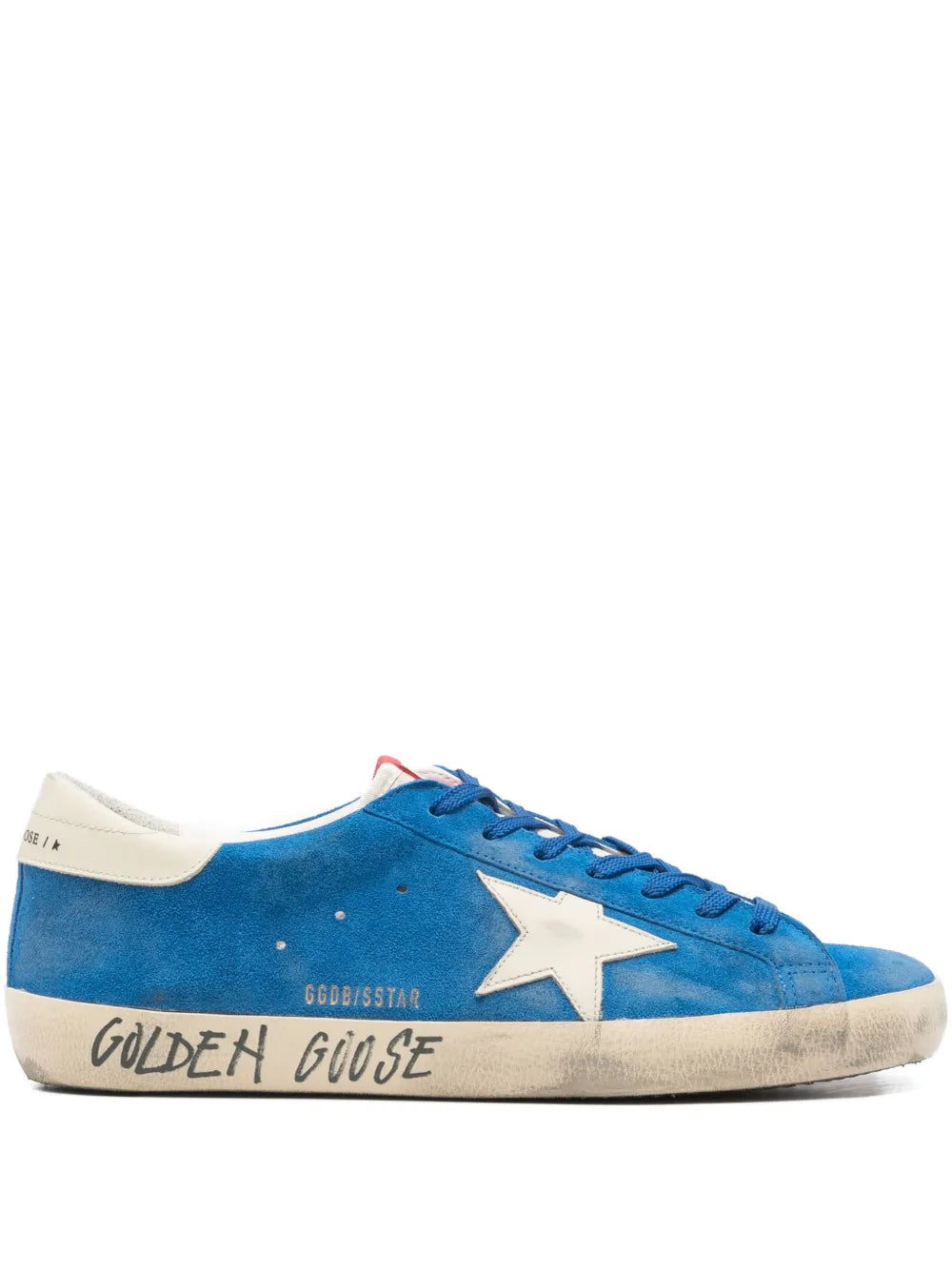 Blue suede low-top sneakers with large star graphic and lace-up front