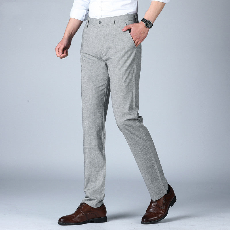 Men's thin dress pants in medium gray, belt loops, button closure, straight leg