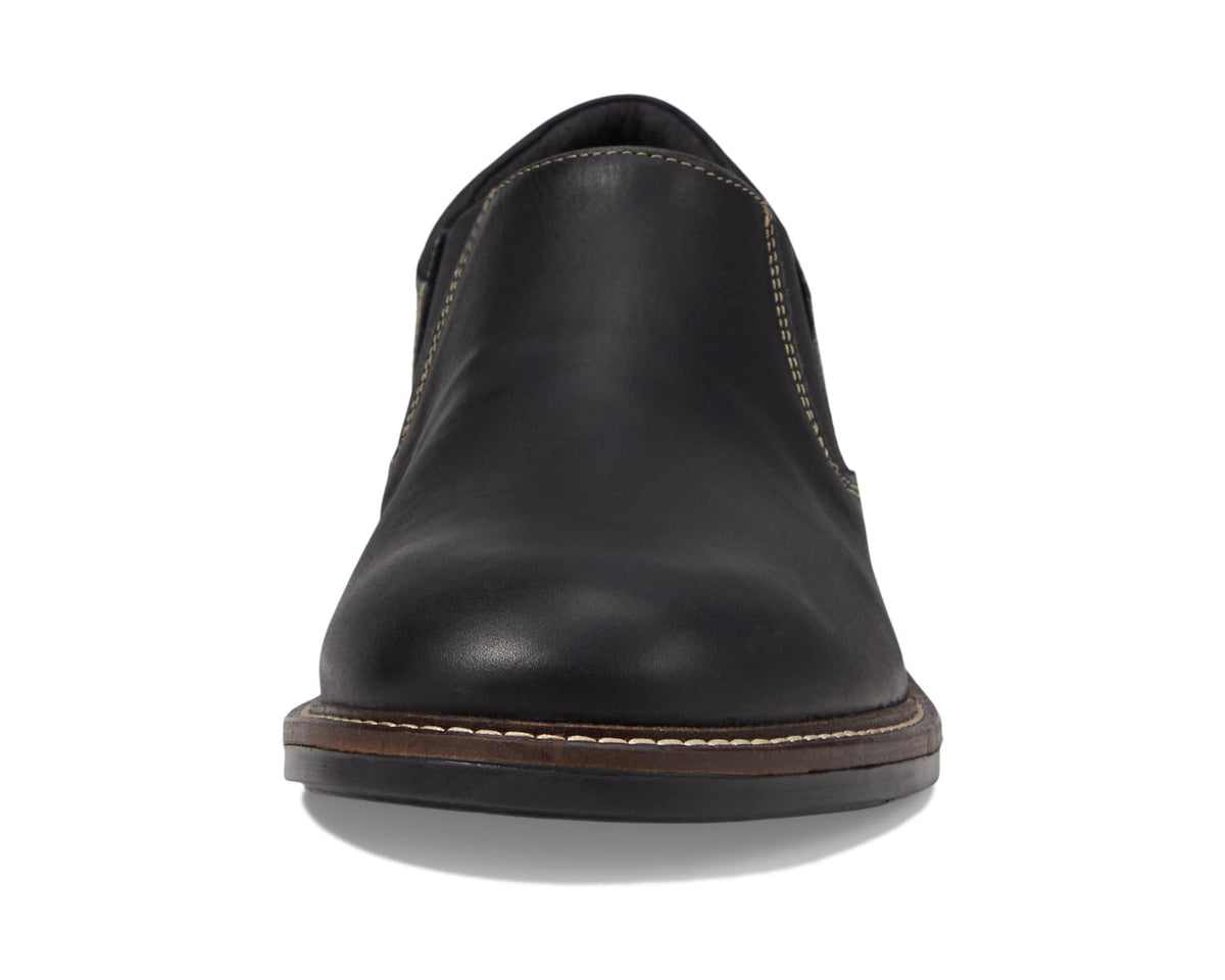 Black leather slip-on shoe front view with low profile rounded toe