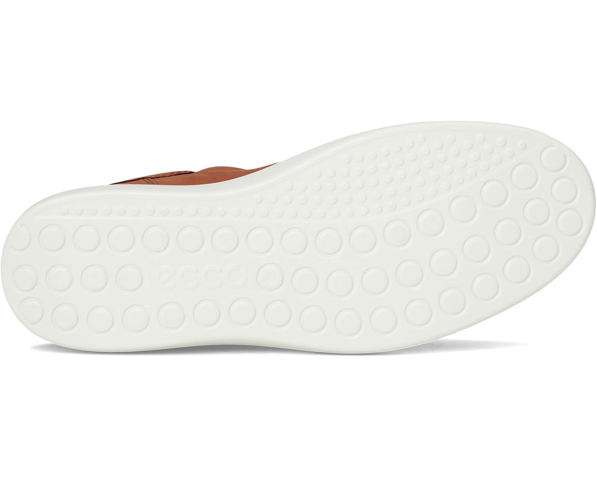 Mink suede sneaker outsole with circular tread pattern and white rubber sole