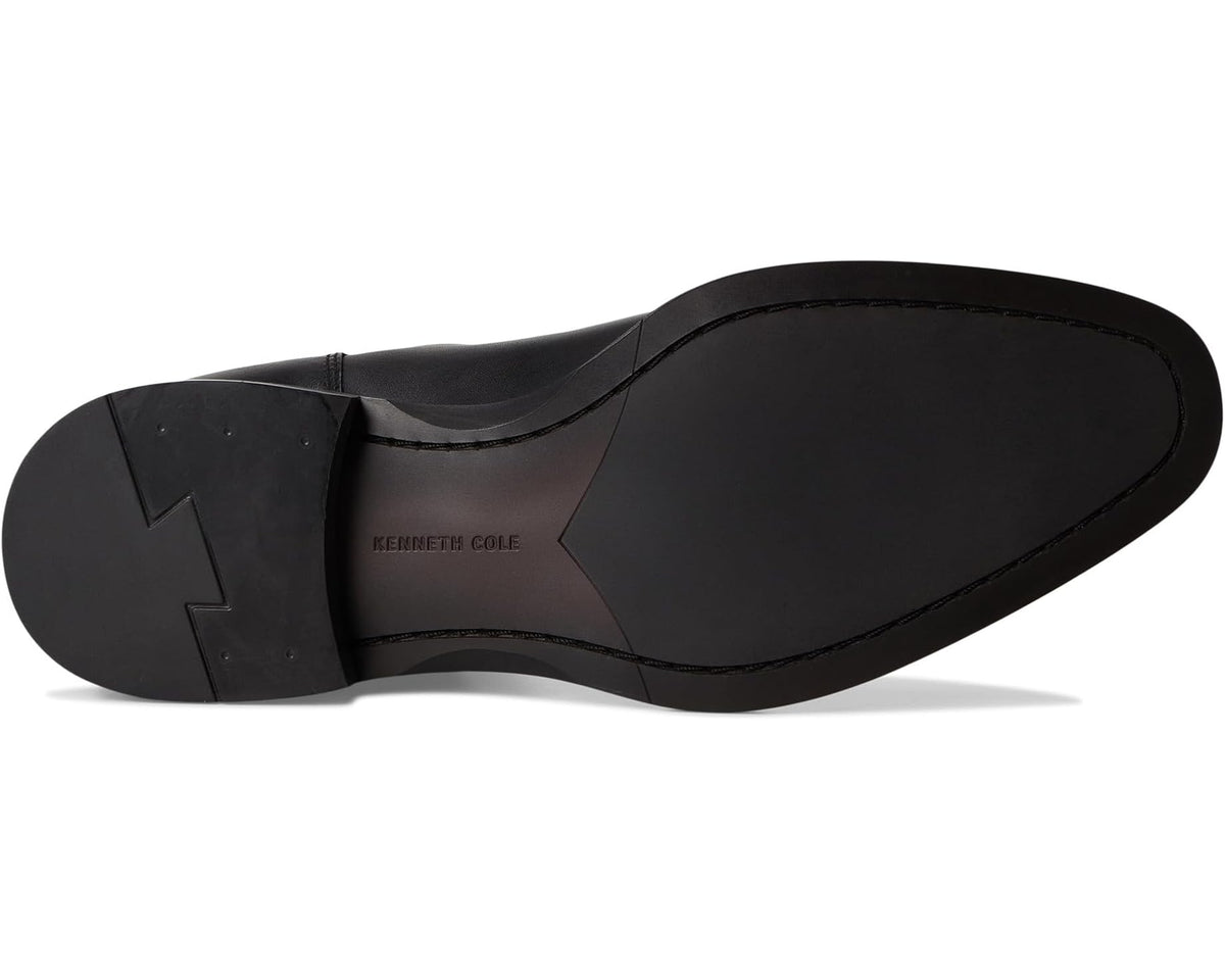 Black chelsea boot outsole view with heel section and treaded bottom
