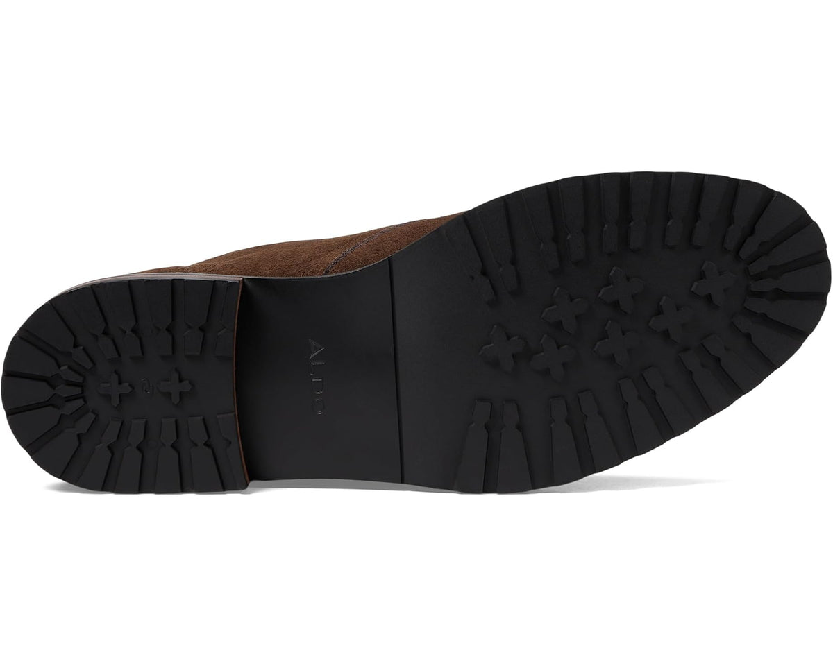 Brown suede boot outsole with textured tread and heel section