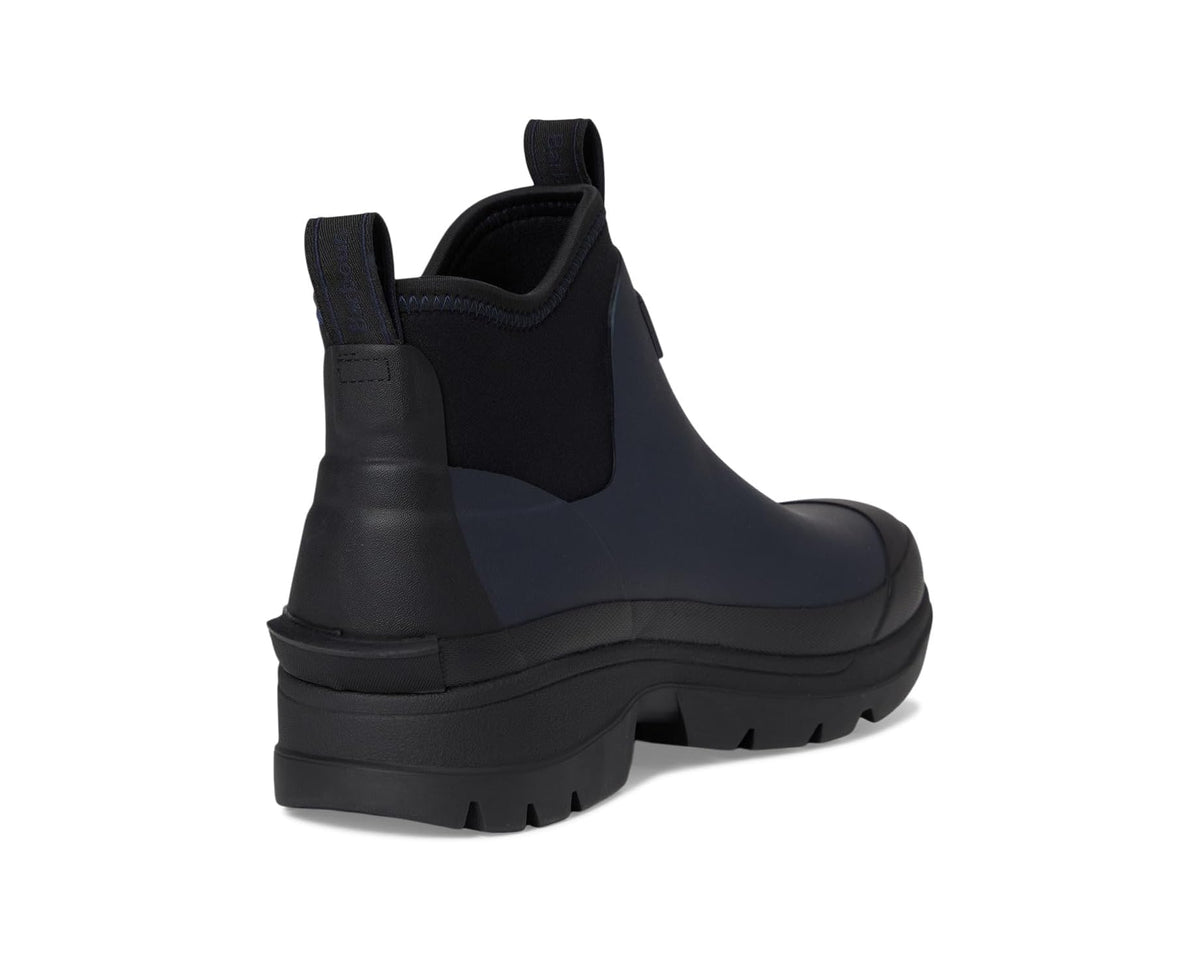 Navy ankle-height chelsea rain boot with elastic gores and chunky traction outsole