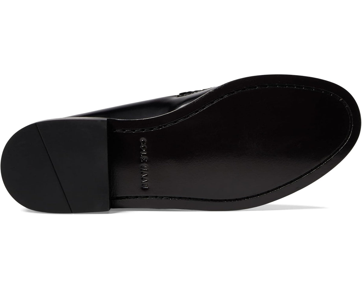 Black leather penny loafer outsole view with brand logo on heel