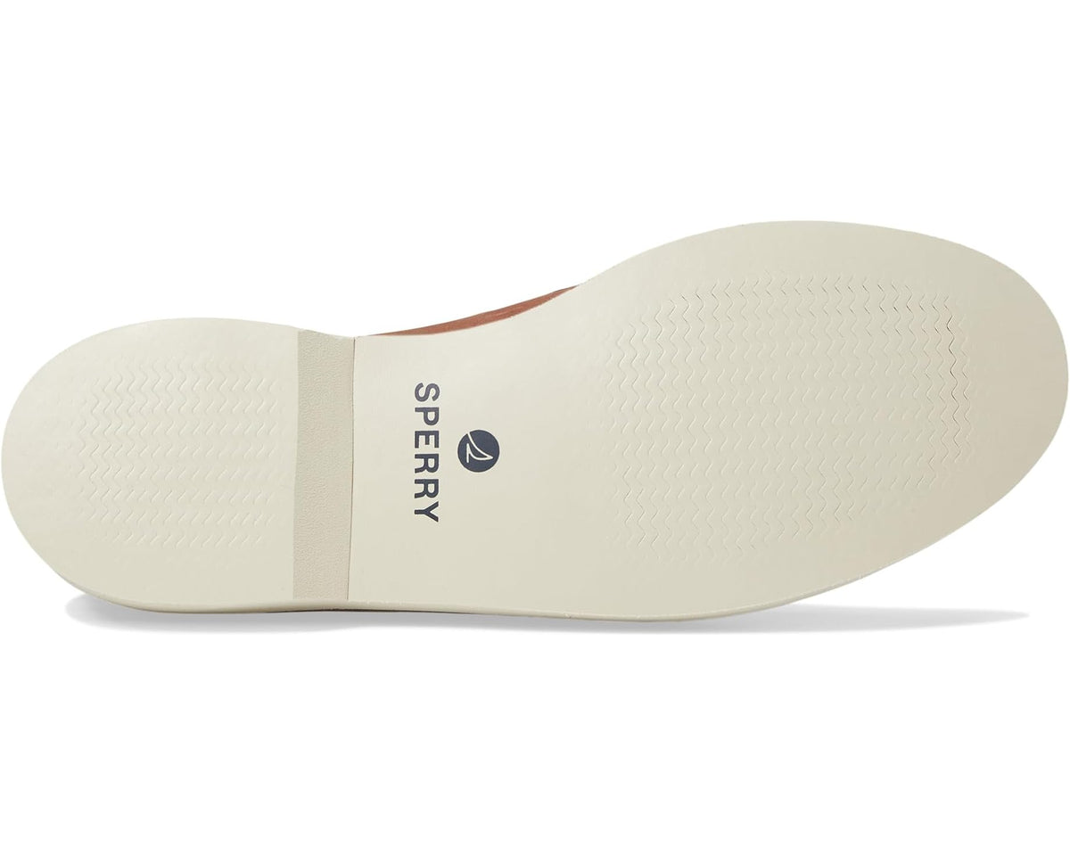 Brown boat shoe outsole view with Sperry logo on white sole