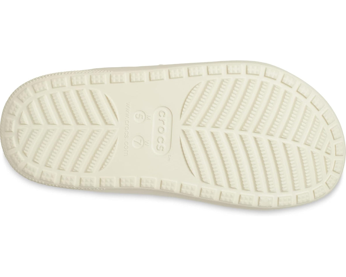 Crocs unisex sandals outsole view, textured traction sole in light bone.