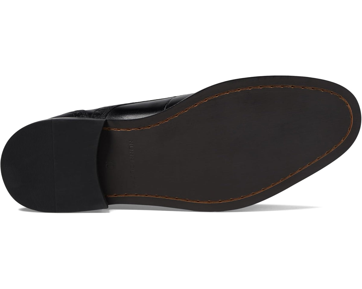 Black Oxford dress shoes with rubber sole and tan welt stitching detail