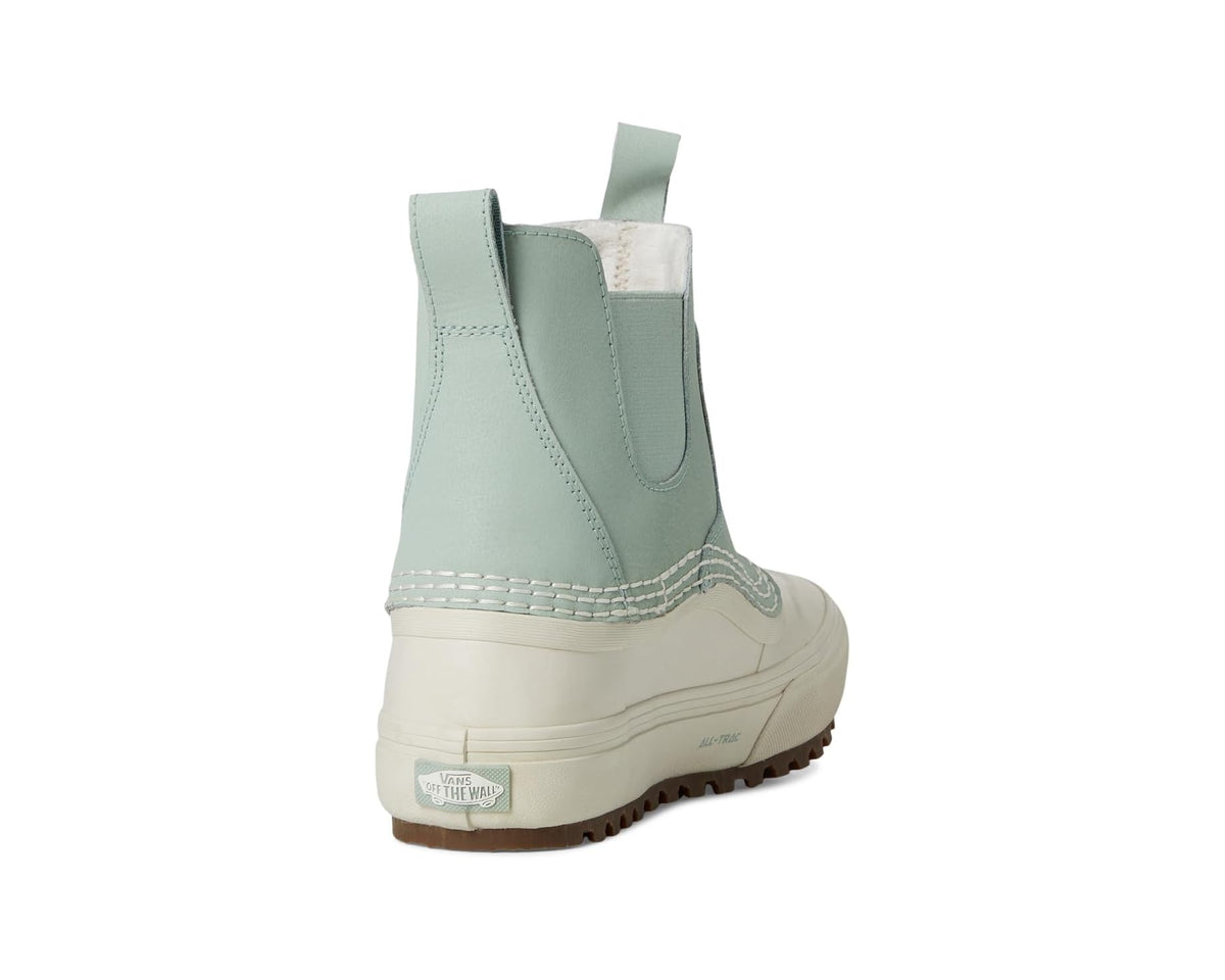Heel and side profile of light green-gray waterproof Chelsea boot with padded collar