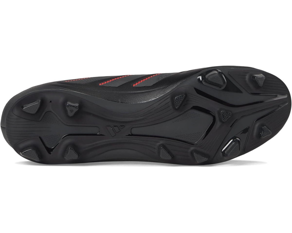 Black firm-ground soccer cleats outsole with molded studs and red details