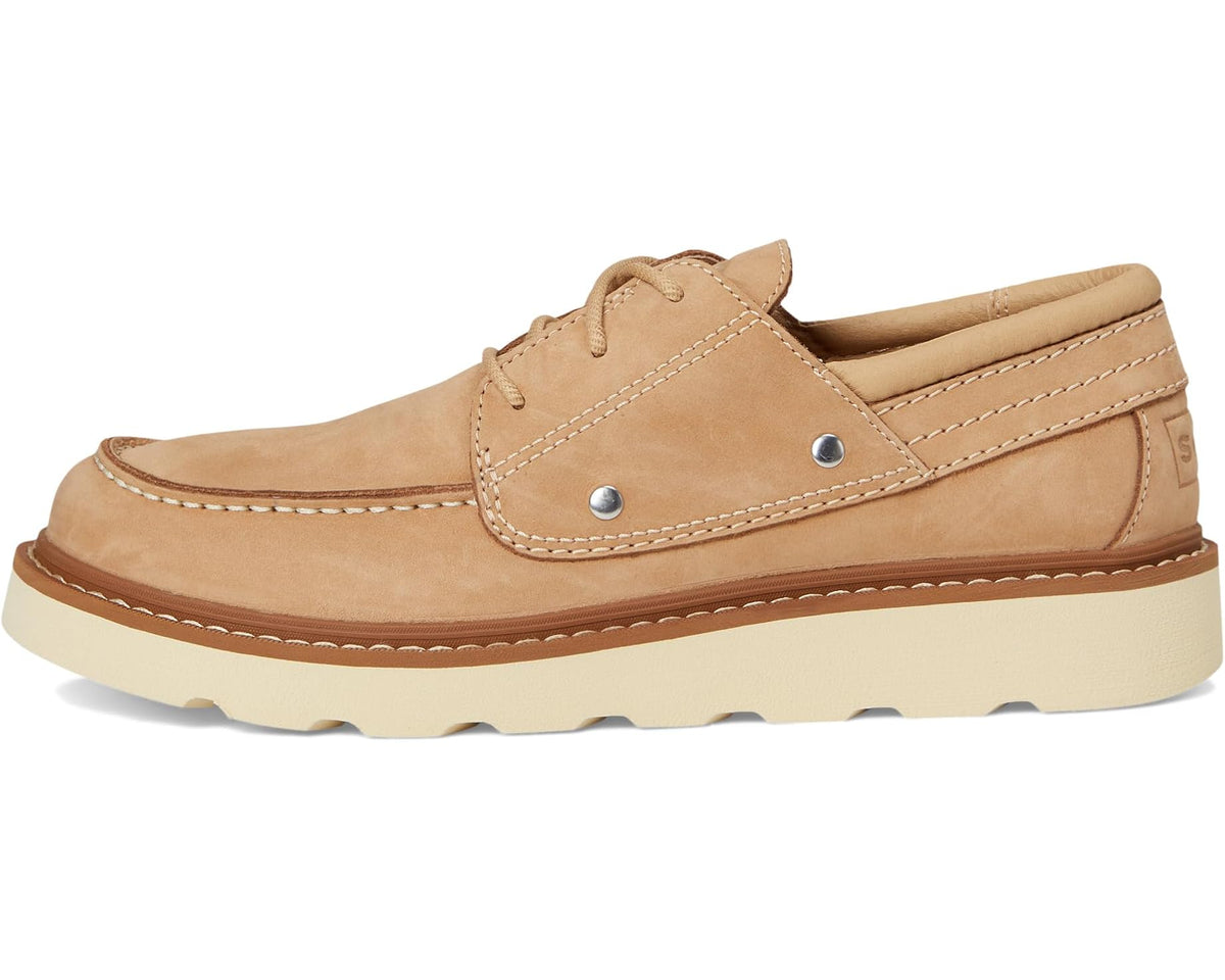Tan suede lace-up canoe moc with metal eyelets, moc stitching, and cushioned sole