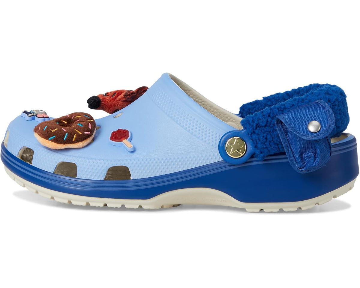 Light blue unisex Crocs clog with dark blue strap and plush lining; character graphics