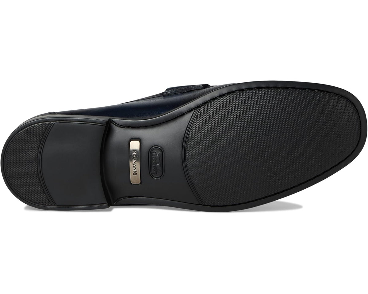 Navy leather loafer outsole view with textured tread and heel