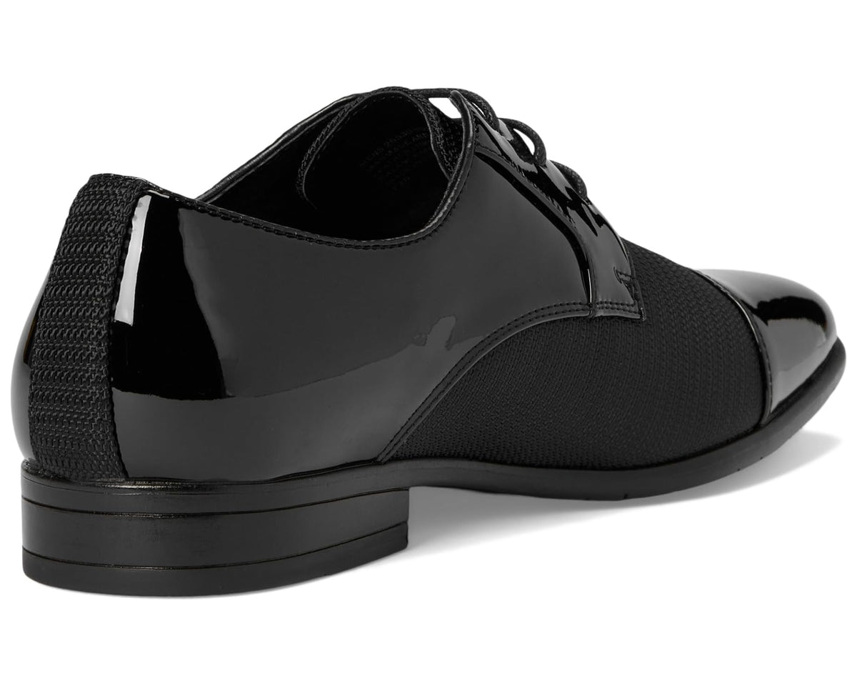 Black oxford shoes with textured sides and smooth patent heel panel