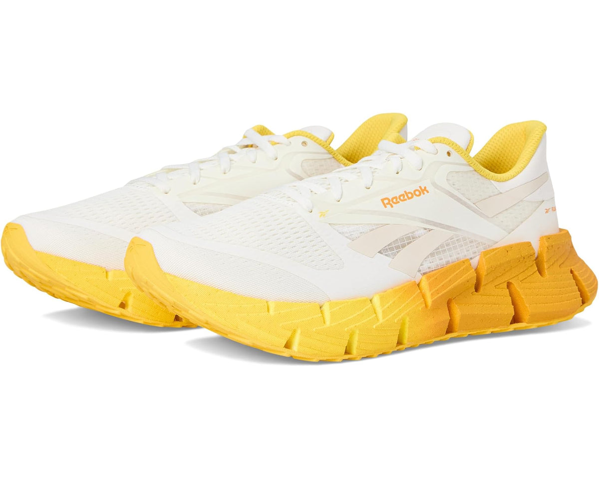 Men's white and yellow lace-up running sneaker with chunky traction outsole