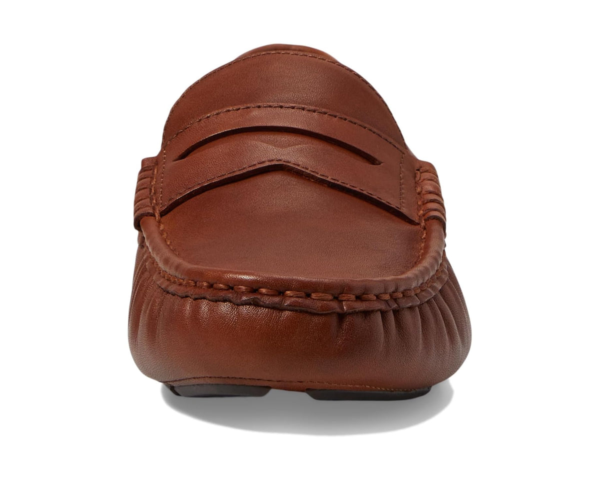 Brown leather penny loafer front with rounded moc toe and stitched apron