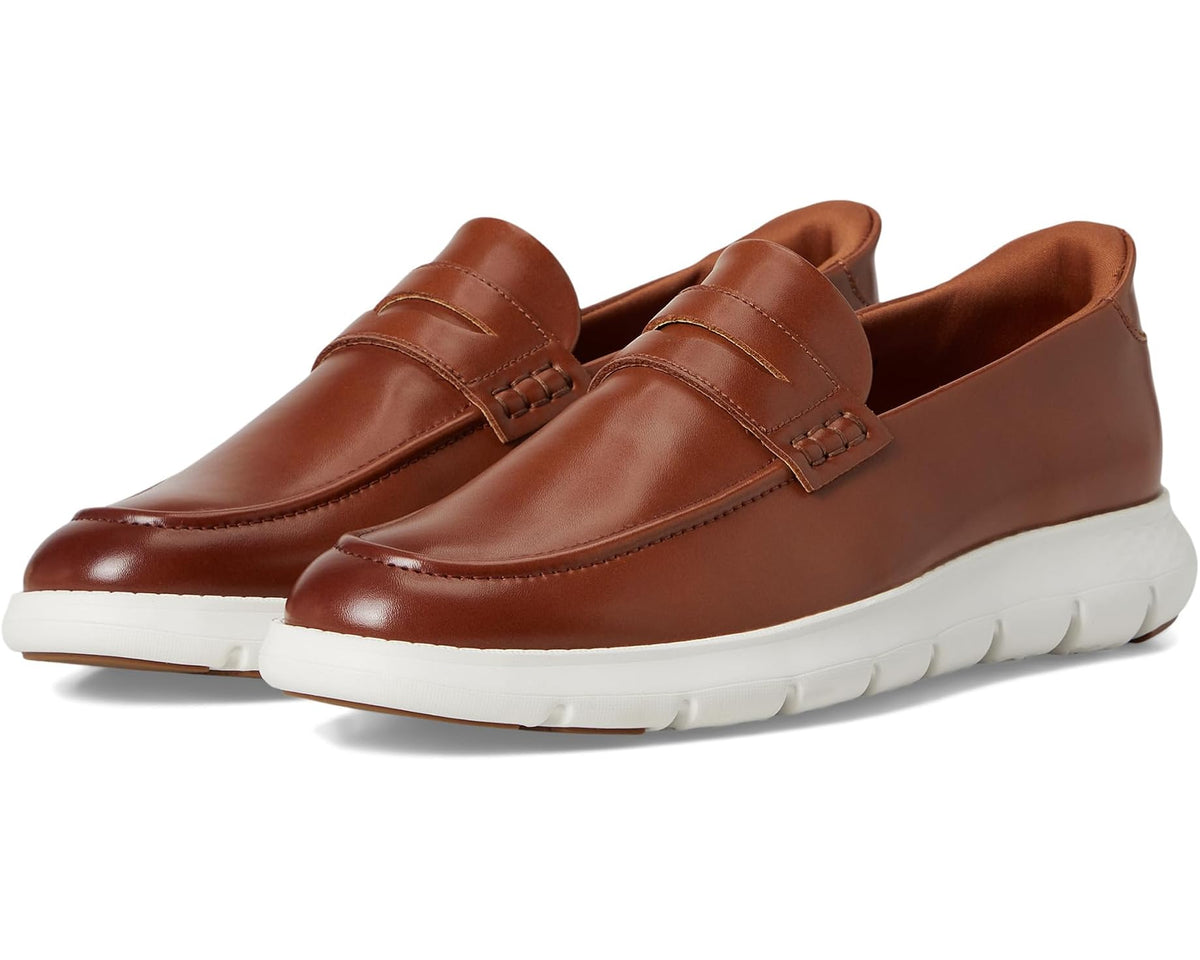 Cognac leather slip-on loafer with white rubber sole and strap detail