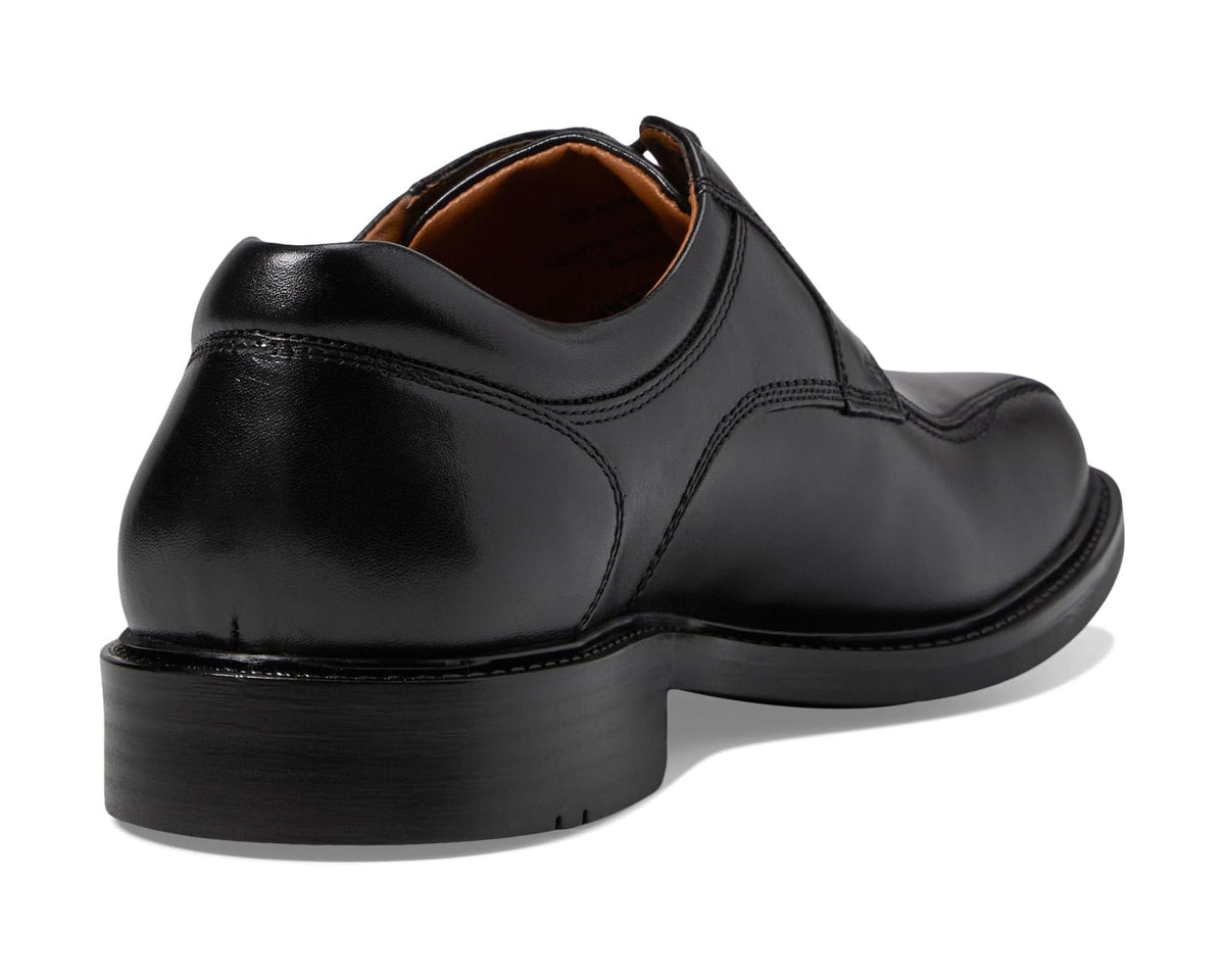 Black leather lace-up shoe heel with stitching and brown interior lining
