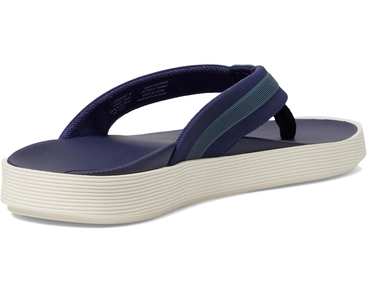 Men's OluKai Leeward navy flip-flops, angled view of straps and ribbed white midsole