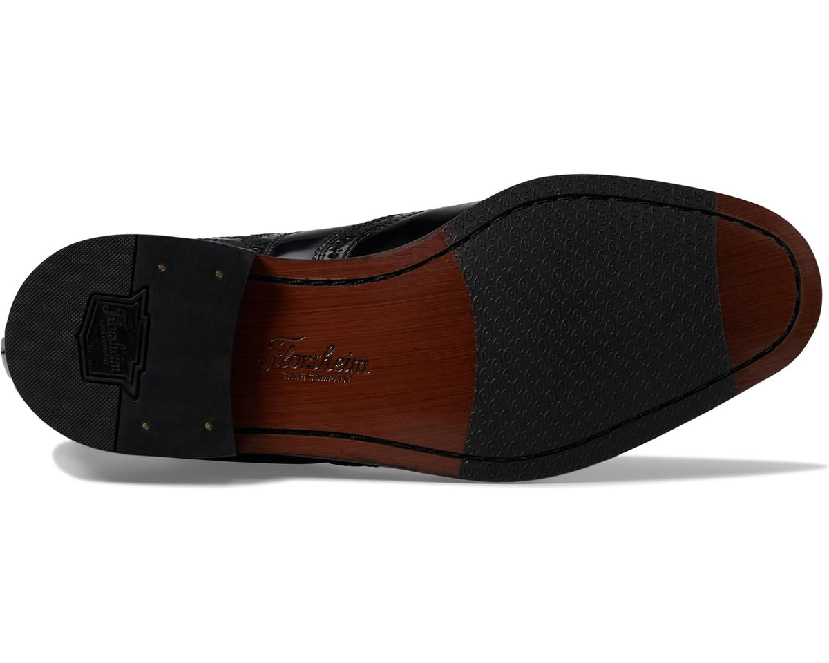 Men's black oxford shoes showing sole and brown interior lining