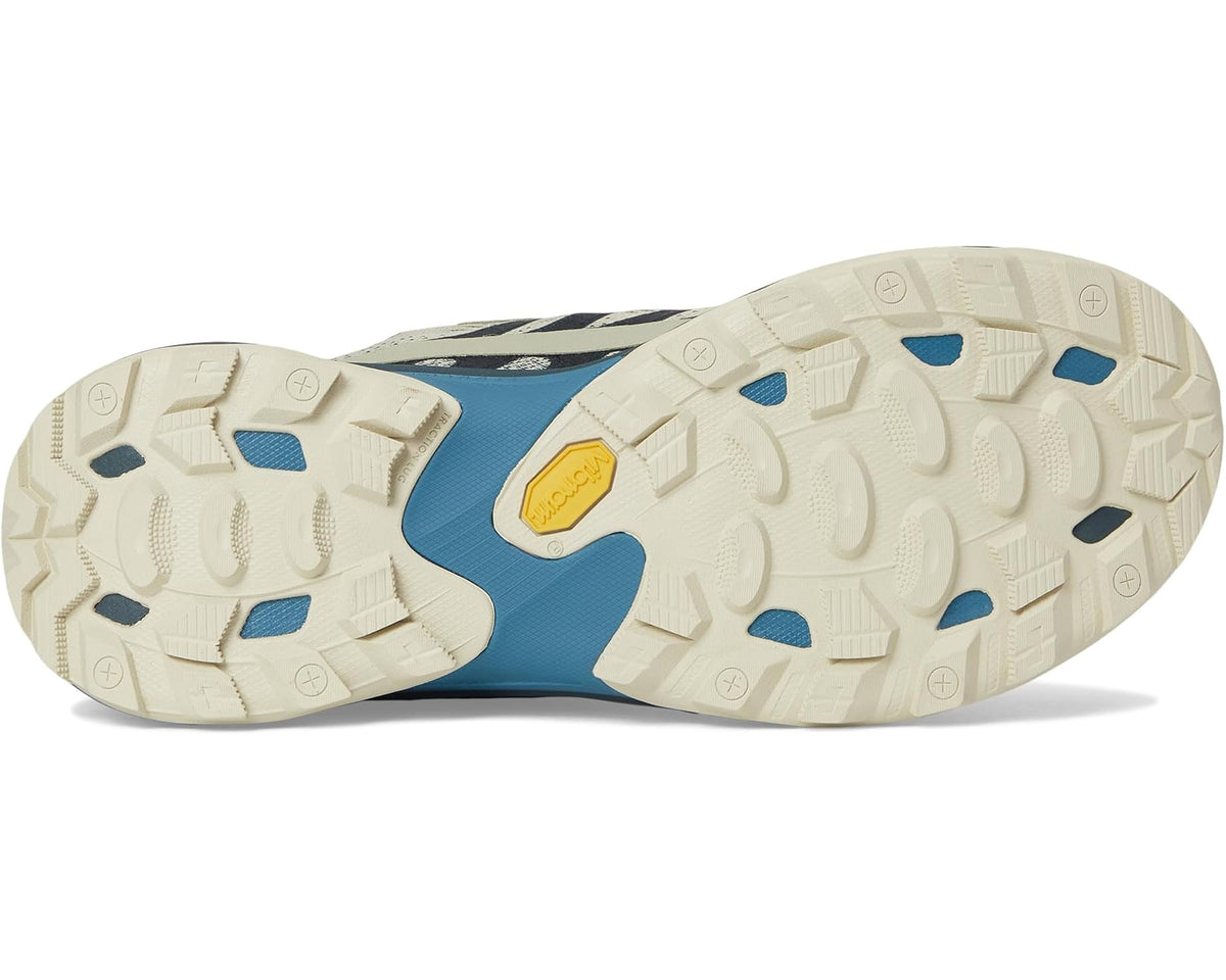 Rugged outsole view of Men's Merrell tan and blue trail sneaker with traction lugs