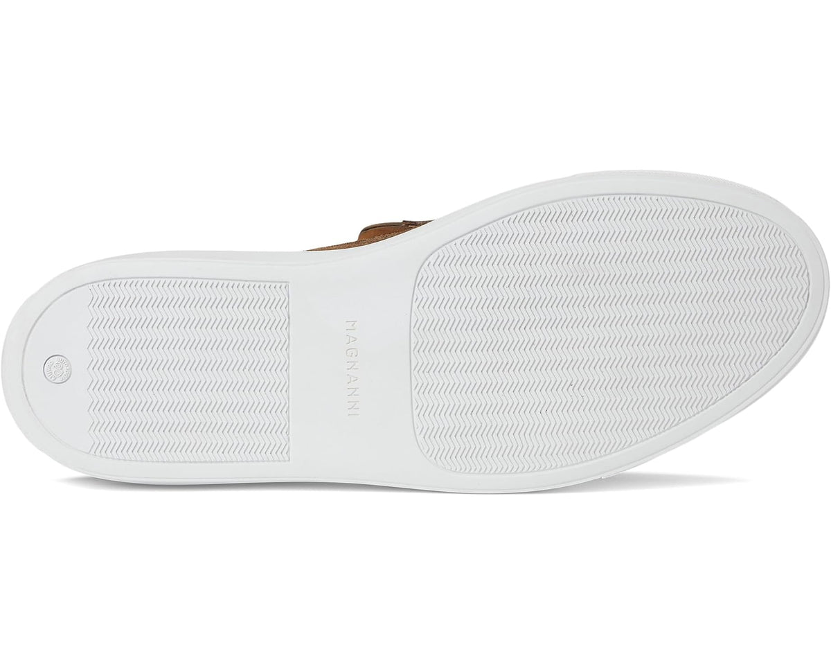 Suede slip-on moccasin outsole with textured tread and white rubber sole