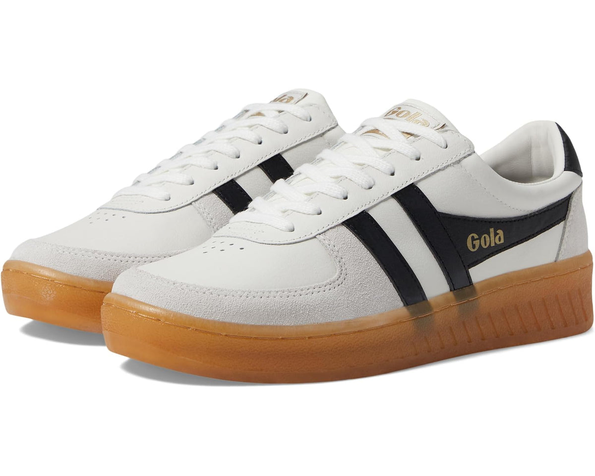 Men's low-top sneakers with white leather uppers, black stripes, gum rubber sole