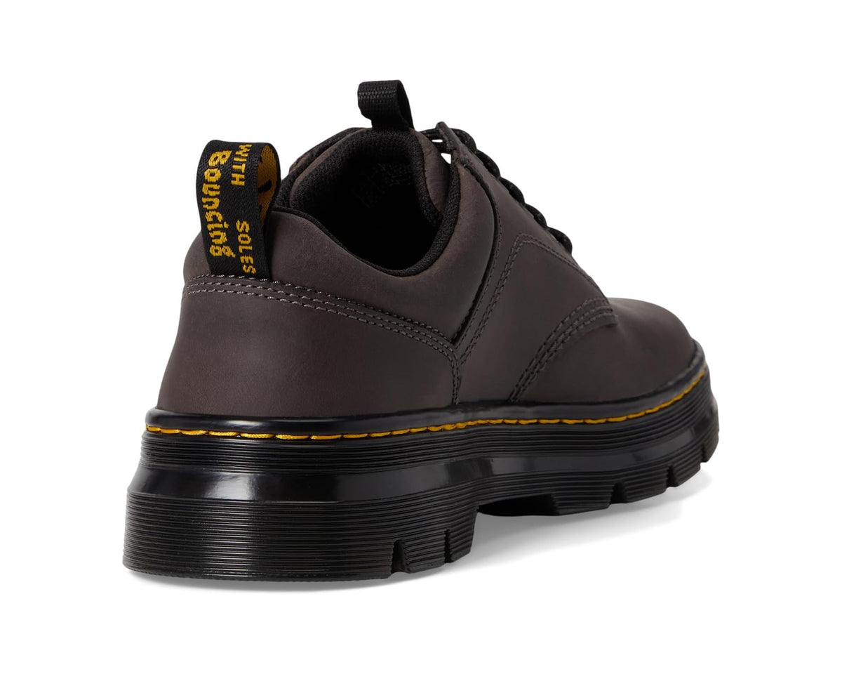 Unisex leather lace-up shoe heel view, gunmetal upper with black sole and pull tab