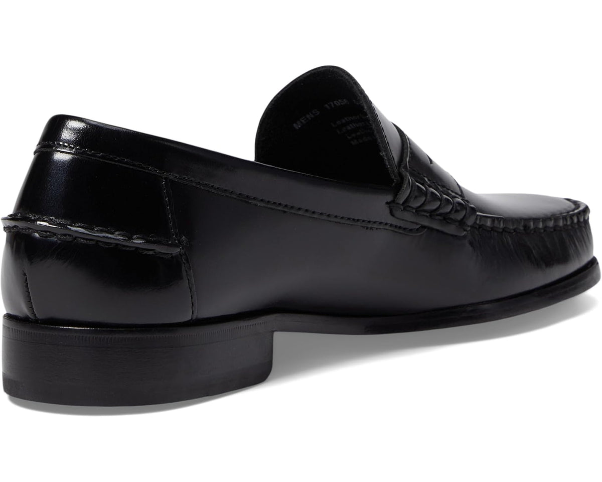 Black leather penny loafer with low block heel and rear stitching