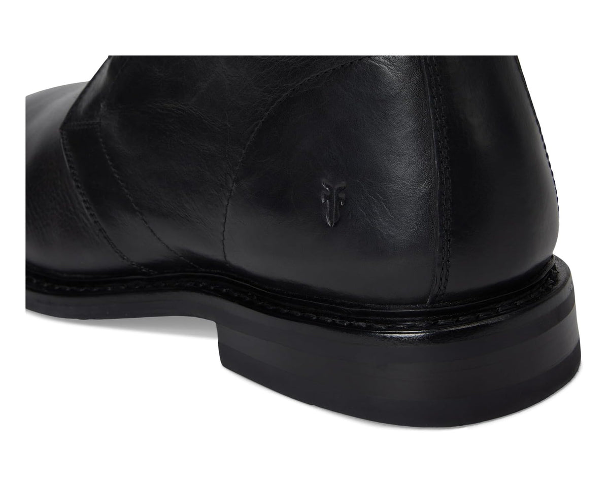 Black leather chukka boot back detail with small logo and thick sole