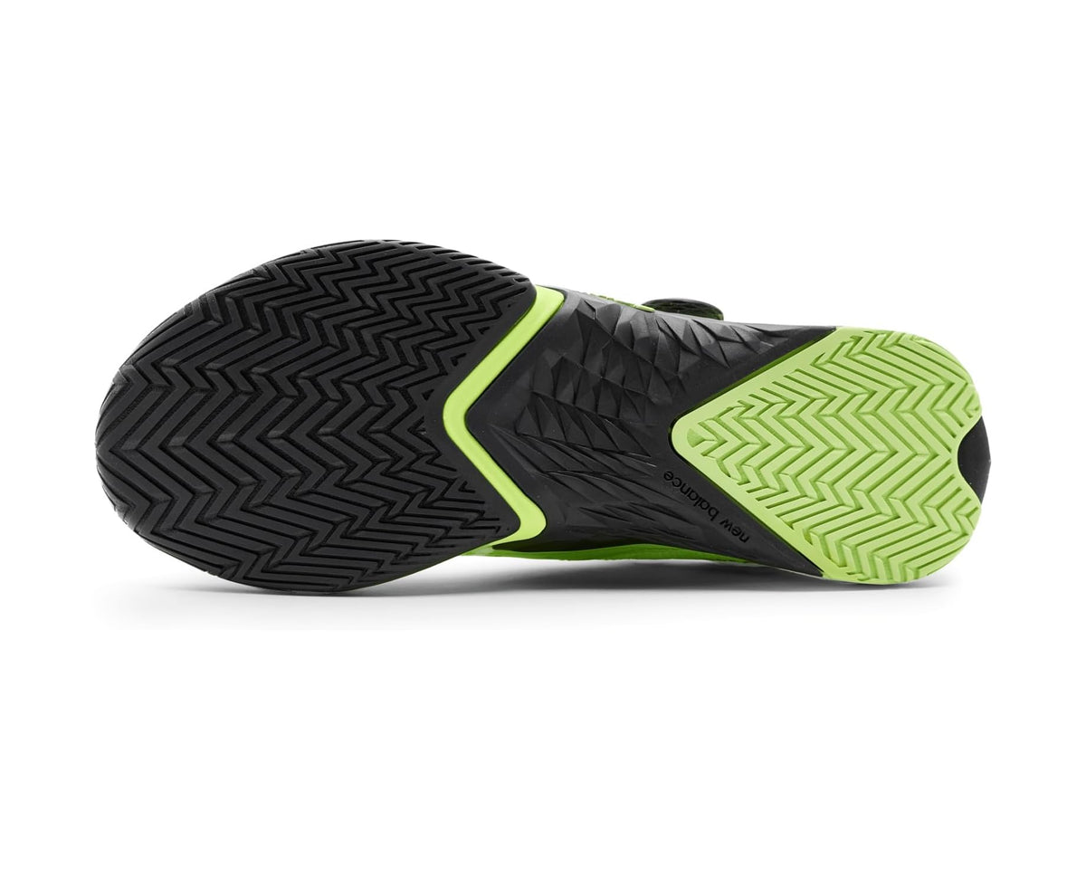 Men's training shoe outsole with black traction tread and neon green side edge