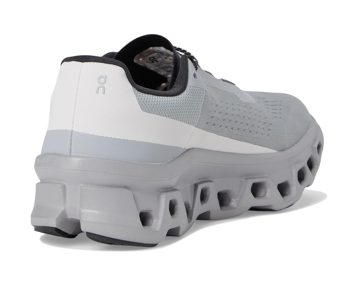 Heel and back view of gray running shoe with black heel tab and cushioned sole