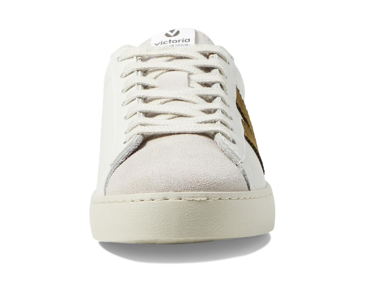 Unisex leather low-top sneakers, front view with lace-up panel and khaki toe insert