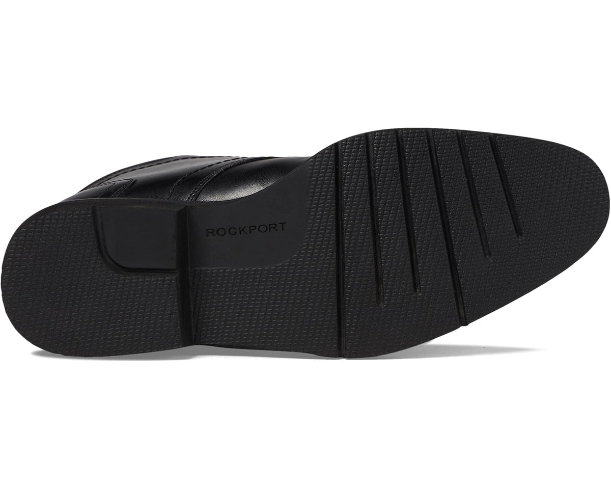Black leather boot outsole with textured tread and Rockport logo on side