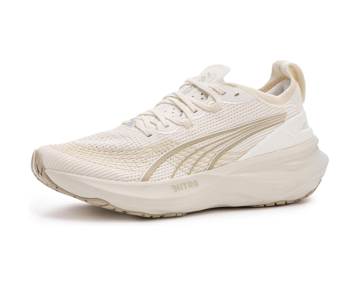 Off-white running shoes with lace-up front and PUMA logo on side