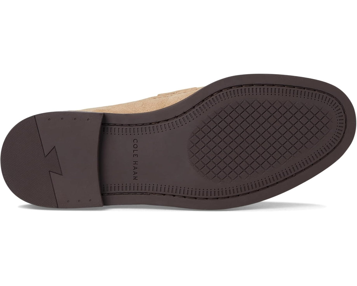 Suede penny loafer outsole with textured rubber tread and dark chocolate heel