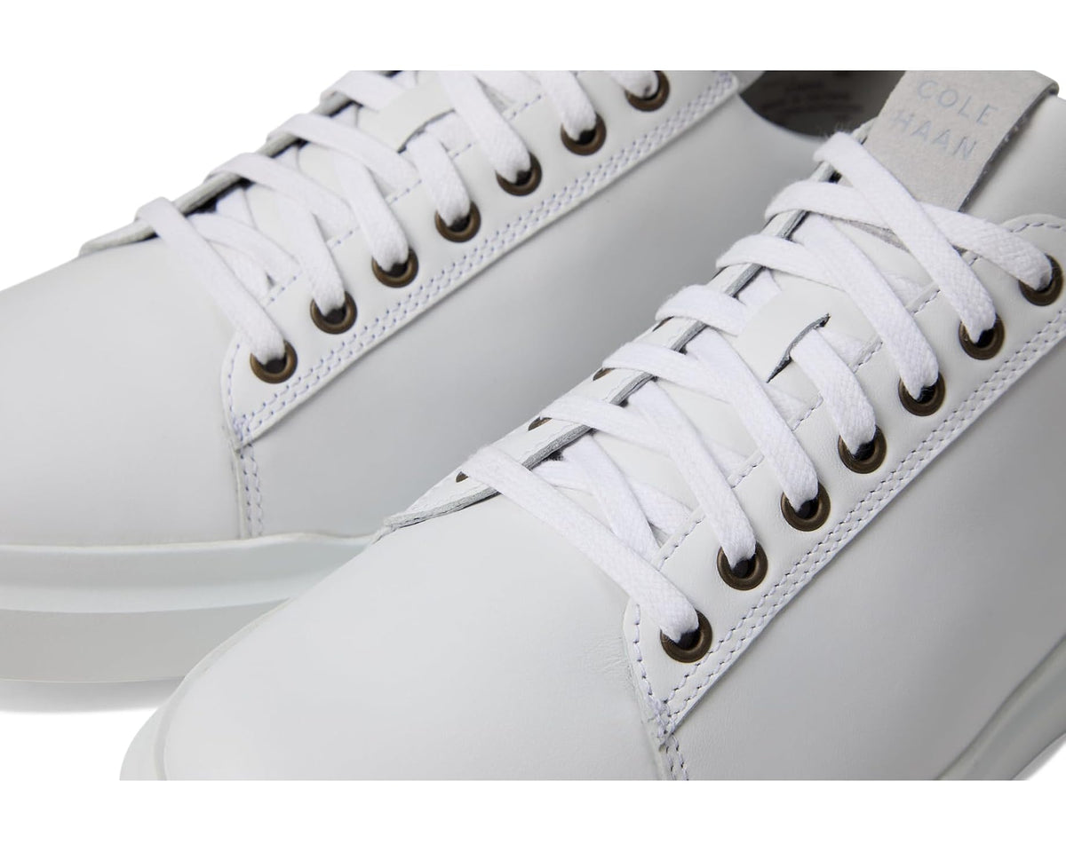 Cole Haan Grandpro Rally sneaker close-up, white leather with lace eyelets and stitching