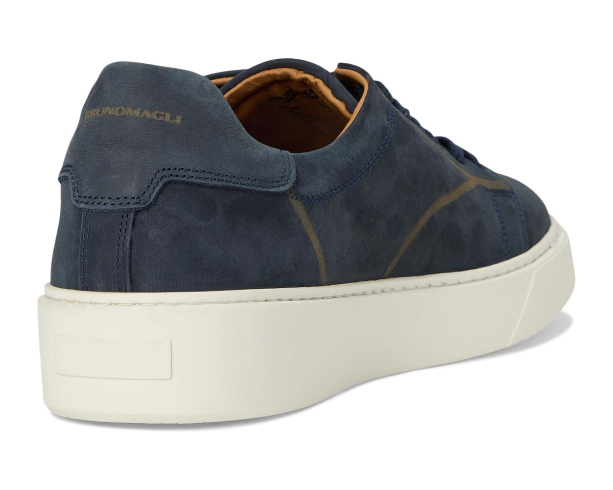 Navy suede low-top sneaker heel with stitched pull tab and white rubber sole