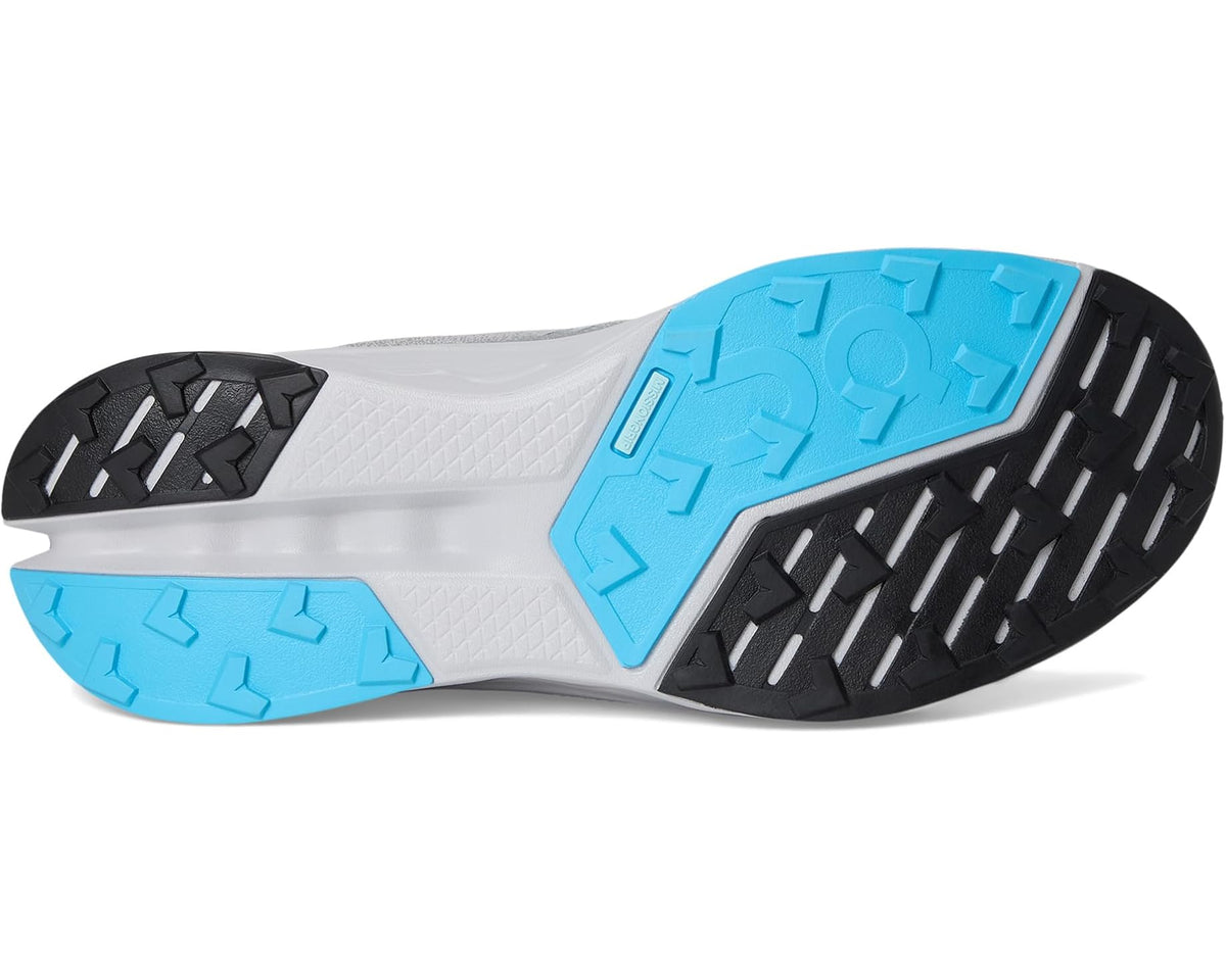 Trail running shoe outsole with black tread and blue traction plates