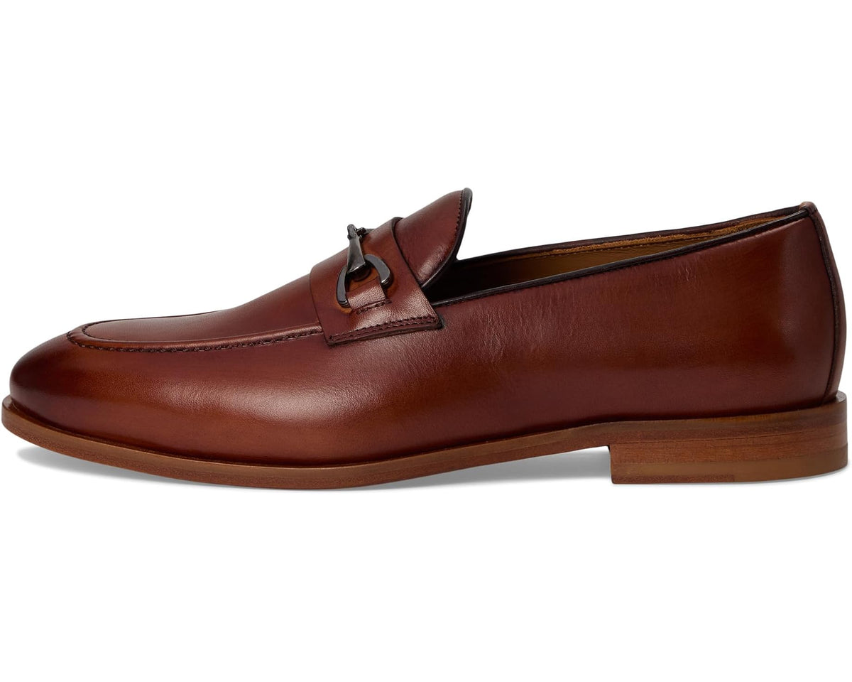 Men's brown leather loafer with buckle strap, moc-style stitching, low heel