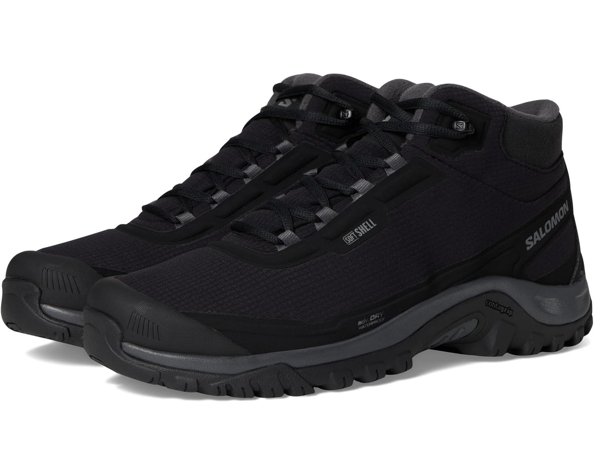 Black Salomon men's mid hiking boot with laced mesh upper and rugged outsole
